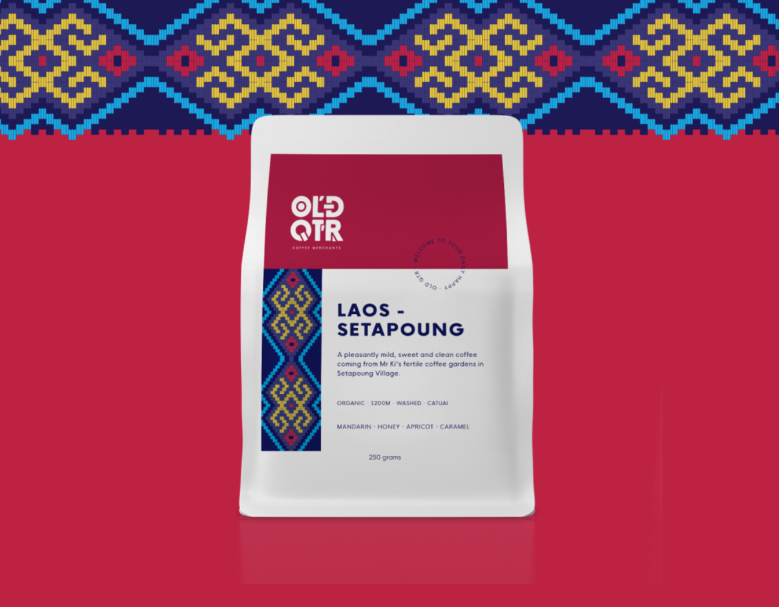  Old Quarter Coffee Merchants  - Ethical Organic Direct Trade Specialty Coffee Roasted in Ballina Australia - Rare Organic Specialty Coffee from Southeast Asia - Laos - Setapoung (Espresso Roast) - Enjoyed With or Without Milk - Bag of Coffee sitting ontop of an espresso machine
